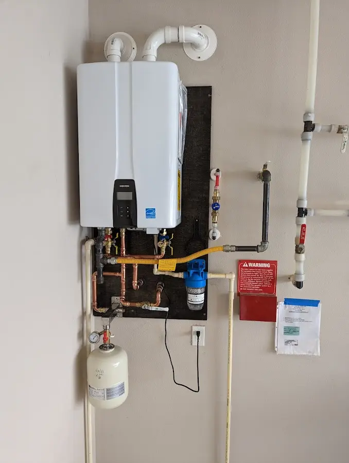 Professional plumber installing copper piping in a Mountlake Terrace home